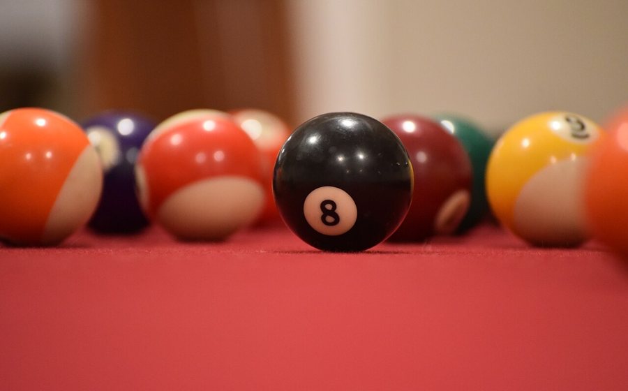 Close-up of resin billiard balls on red cloth (representative photo)