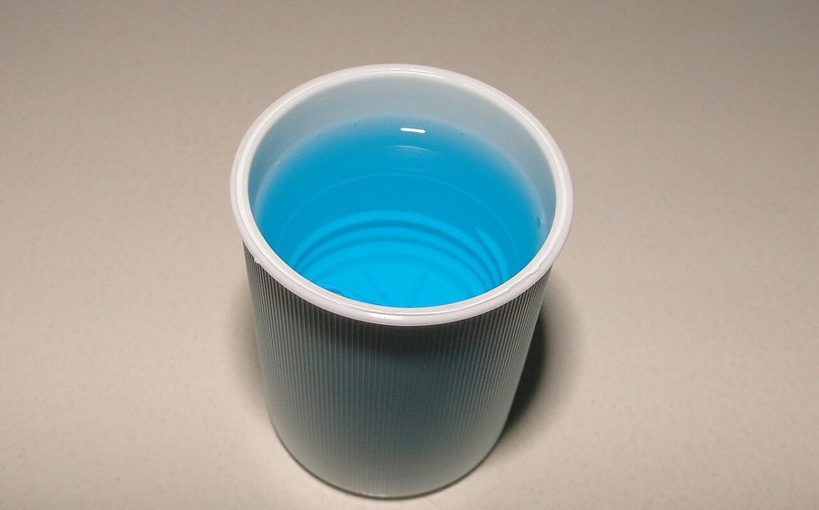 Blue mouth rinse in a small cup (representative photo)